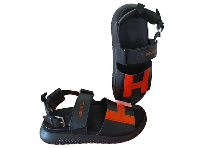 Archipiélago de las Sandalias de Hermès Negro Naranja 