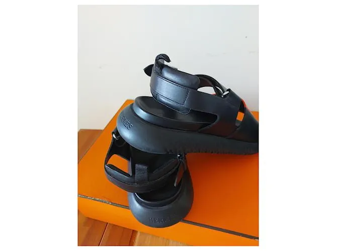 Archipiélago de las Sandalias de Hermès Negro Naranja 